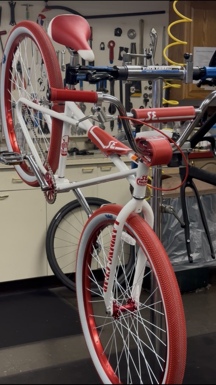 SE bicycle on a repair stand inside Bicycles Plus in Franklin, MA